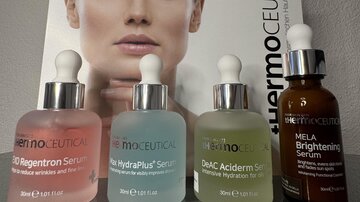 Four different skin serums are displayed in front of an image of a woman showing healthy skin. The products are from the brand Thermoceutical and emphasize skincare.