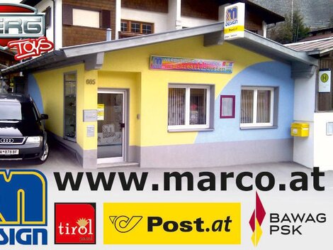 A colorful store with a yellow and blue facade. A black car is parked in front of the building.